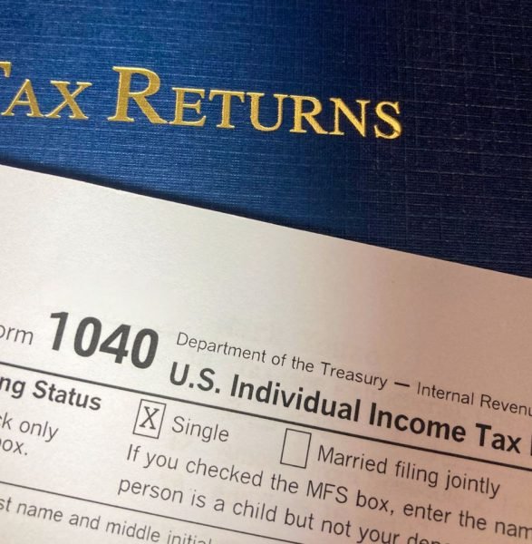 Close-up image of Form 1040 for U.S. tax returns, highlighting filing status options.